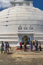 People at the Tissamaharama Raja Maha Vihara Buddhist stupa and temple