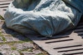 Tissue bag on the sewer grate is close Royalty Free Stock Photo