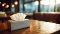 Tissue Box on Restaurant Table in Soft Indoor Lighting Royalty Free Stock Photo
