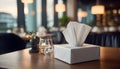 Tissue Box on Restaurant Table in Soft Indoor Lighting Royalty Free Stock Photo
