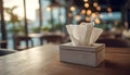Tissue Box on Restaurant Table in Soft Indoor Lighting Royalty Free Stock Photo