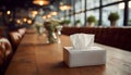 Tissue Box on Restaurant Table in Soft Indoor Lighting Royalty Free Stock Photo