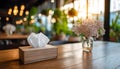 Tissue Box on Restaurant Table in Soft Indoor Lighting Royalty Free Stock Photo