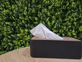 Tissue boxes on the table with leaves in the background Royalty Free Stock Photo