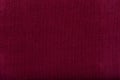tissue structure closeup. fine grain felt ruby fabric. Fabric background. Red fiber texture polyester close-up