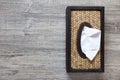 Tissue in the wooden wicker box Royalty Free Stock Photo