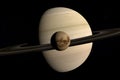 Titan, Saturn moon, rotating and orbiting around Saturn planet. 3d render Royalty Free Stock Photo