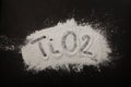 Titanium dioxide powder scattered on black surface