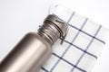 Titanium Hydration Bottle for water on napking. Eco friendly concept Royalty Free Stock Photo