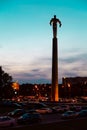 Titanium monument to first astronaut Yuri Gagarin on Gagarin Square at evening dusk.