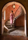 Twenties woman on antique stairs Royalty Free Stock Photo
