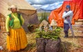 TITICACA, PERU - DEC 29: Indian woman and men peddling her wares Royalty Free Stock Photo