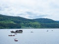 Titisee, Germany - May 28th 2022: Beautiful lake in the midst of the black forest, covered with boats