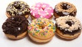 Title assortment of delicious chocolate glazed doughnuts in different flavors and shapes