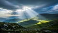 Title: Dramatic landscape with sunlight rays breaking through dark clouds over green rolling hills Royalty Free Stock Photo
