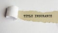 title insurance. words. text on gray paper on torn paper background