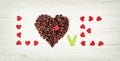 Title LOVE of coffee beans and many little red hearts on the woo