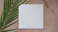 Title: Summer wedding stationery mock-up scene. Blank card, invitation in sunlight. Palm leaves, greeting card and silk ribbon. Co