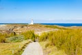 The lighthouse `Poulains` of the famous island Belle Ile en Mer Royalty Free Stock Photo