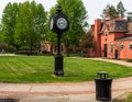 Titusville, Pennsylvania, USA May 16, 2023 A clock on the campus of Pitt-Titusville University with Bennet Davis Hall