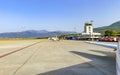 Tivat airport with aiplanes and mountains Royalty Free Stock Photo