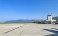 Tivat airport with aiplanes and mountains Royalty Free Stock Photo