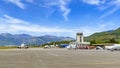 Tivat airport with aiplanes and mountains Royalty Free Stock Photo