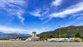 Tivat airport with aiplanes and mountains Royalty Free Stock Photo