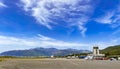 Tivat airport with aiplanes and mountains Royalty Free Stock Photo