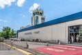 Tivat airport building with a title sign on the wall - outside view