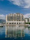 Tivat, Montenegro - 11 august 2023: Yellow facade with terraces of the Regent Hotel. Porto, Montenegro
