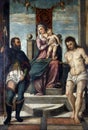 Tiziano Vecellio follower: Madonna and Child on the throne with St. Roch and St. Sebastian