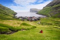 Tjornuvik village with view of sea stacks Risin and Kellingin, Faroe Islands