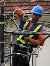 TM Employee Sealing A Cable Joint