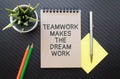 TMDW Teamwork makes dream work symbol. Concept words TMDW Teamwork makes dream work on white note on beautiful wooden background