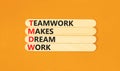 TMDW Teamwork makes dream work symbol. Concept words TMDW Teamwork makes dream work on wooden stick on beautiful orange background Royalty Free Stock Photo