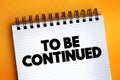 To Be Continued text on notepad, concept background Royalty Free Stock Photo