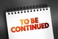 To Be Continued text on notepad, concept background Royalty Free Stock Photo