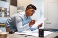 To build success you need a plan. a young architect designing a building plan in a modern office. Royalty Free Stock Photo