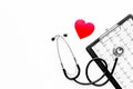 To diagnose heart disease. Heart sign, cardiogram, stethoscope on white background top view copyspace