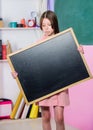 To do list. Back to school. Happy teachers day. 1 september. Small girl demonstrate blank chalkboard. Small school girl Royalty Free Stock Photo