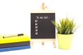 Book,pen and Mini chalkboard isolated over white. Royalty Free Stock Photo