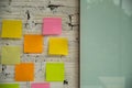 A To Do List with colorful note papers on glass wall Royalty Free Stock Photo
