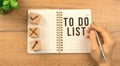 To do list 2022 concept. Wooden table background with empty notebook. Planning for new year, goal list, strategy. Top Royalty Free Stock Photo