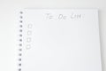 To Do list with empty checkbox in paper notebook with white sheets, selective focus. Top view, above