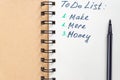 To do list - make more monTo do list - make more money written text on note pad. Close upe written text on note pad Royalty Free Stock Photo