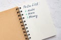 To do list - make more monTo do list - make more money written text on note pad. Close upe written text on note pad Royalty Free Stock Photo