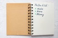 To do list - make more monTo do list - make more money written text on note pad. Close upe written text on note pad Royalty Free Stock Photo