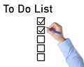 To Do List. Man ticking check boxes with pen on white paper, top view Royalty Free Stock Photo
