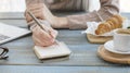 To do list, organize plans, projects, checklist, Productivity Works. Woman writing to do list. Close up of female hand